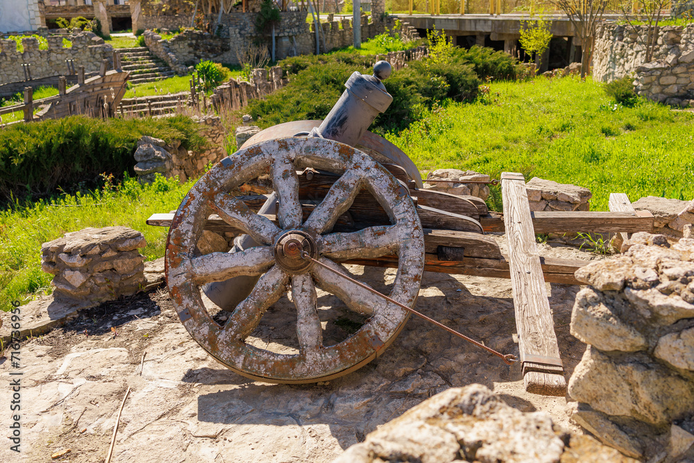 Decorative wheel, rustic symbol of progress. Background with selective focus and copy space