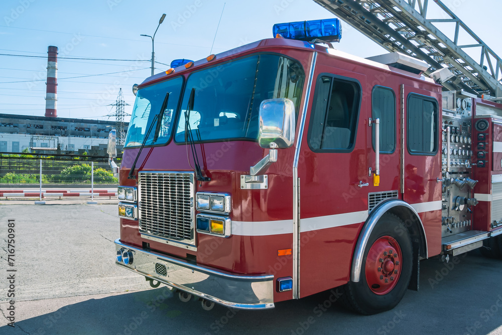 The cabin of a fire truck with a retractable ladder. A fire truck for delivering firefighters to the fire site and supplying extinguishing agent for extinguishing. The rescue service.
