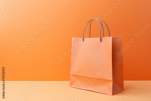 A sleek paper shopping bag against a dreamy bokeh orange background perfect for showcasing consumer goods. Elevate your advertising with AI generative imagery.