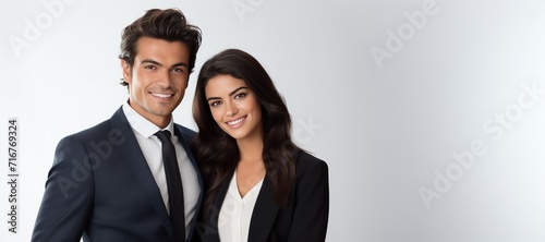 Banner smiling handsome young man and young woman in business clothes at grey background.Сoncept of real estate managers, bank workers, insurance workers, lawyers,