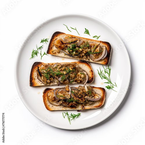 Sardine Toast with onion pieces on a plate isolated on a white background is in the top view