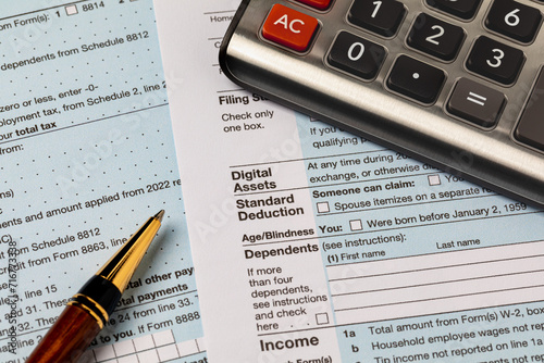 Digital assets question on 1040 federal income tax return form. Cryptocurrency, NFT and security token taxes concept photo