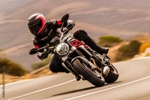 Dynamic image of a motorcyclist in full gear leaning into a turn on a scenic road.