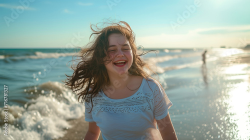 Smiling chubby teenage girl with blond hair enjoying a summer day on the beach by the ocean, radiating beauty and happiness photo