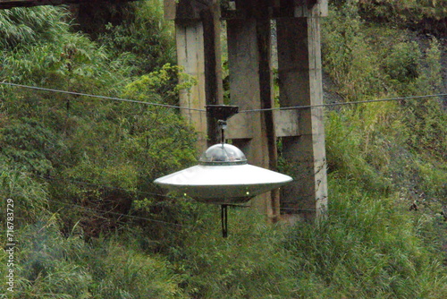Flying saucer ride on a cable at a waterfall in Banos, Ecuador