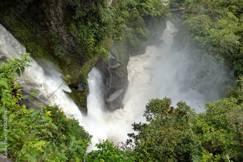 Viewing point in the gorge, above the pool at the base of the Pailon del Diablo waterfall in Banos, Ecuador photo