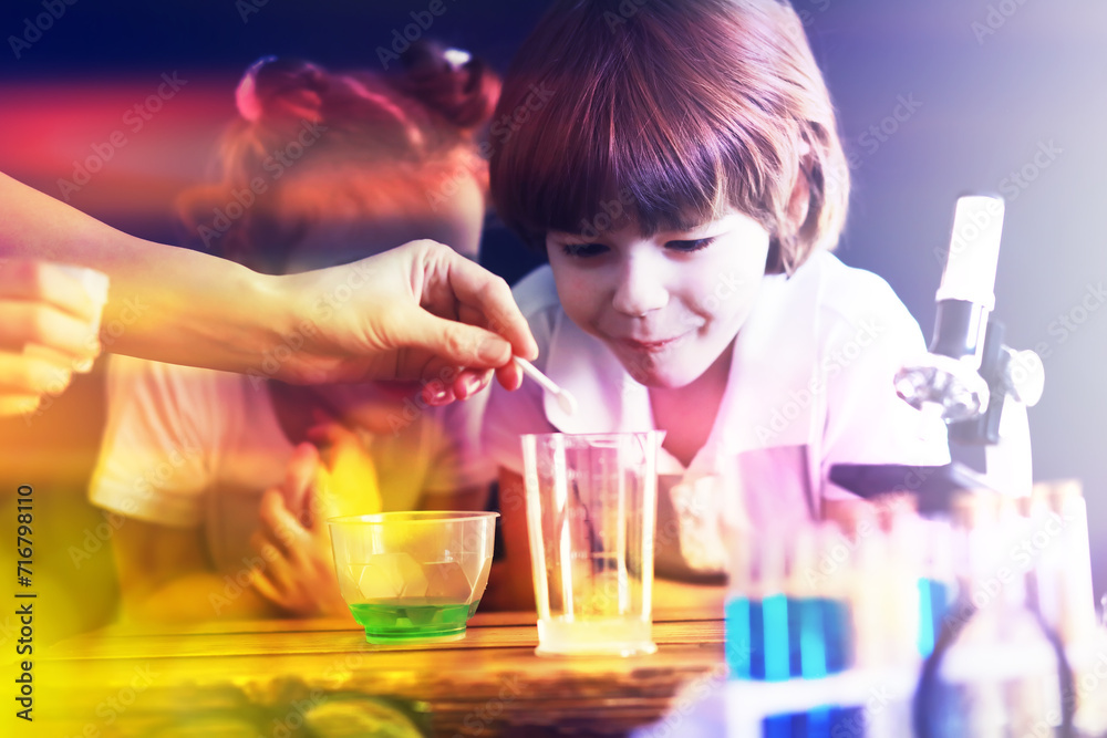 Background with highlights of children of scientists. A boy and a girl are experimenting in the laboratory. Background with highlights of children of scientists. A boy and a girl are experimenting in the laboratory.