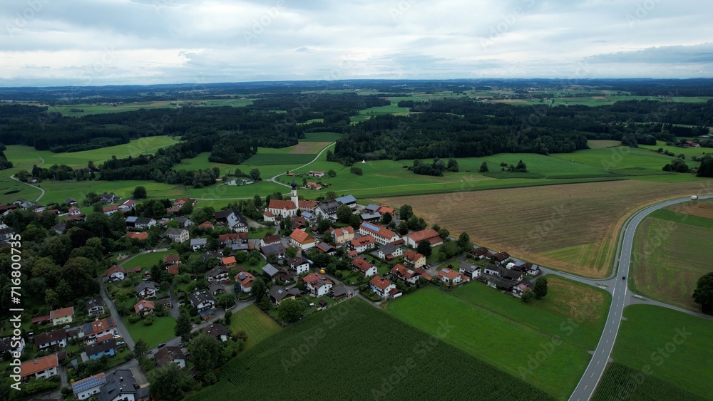 Aerial around the village Schonstett in Germany on a cloudy day in late summer