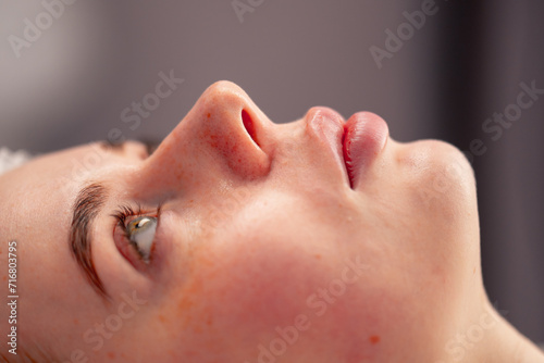 close-up of a client's face during health rejuvenation beauty procedure in a beauty salon skin care