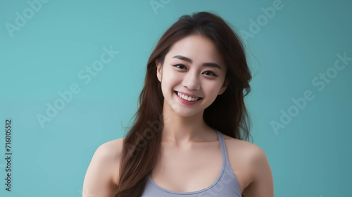 Asian woman in sports bra isolated on background.
