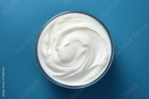 Delicious, Creamy Yogurt Swirl in a Rustic Wooden Bowl with Fresh, White Milk - Closeup, Overhead View