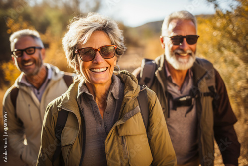 A lively group of active hiking, seniors embarks on a nature-filled adventure, traversing scenic trails with joy and camaraderie, embracing the beauty of the outdoors © Microgen