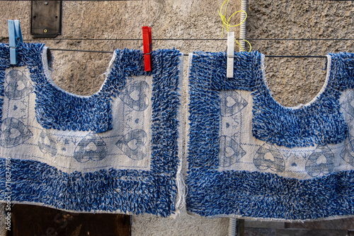 Palermo, Sicily, Italy Bathroom mats hanging out to dry on a clothese line. photo