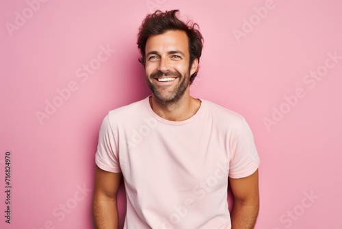 Portrait of a happy man in his 30s sporting a vintage band t-shirt against a pastel or soft colors background. AI Generation