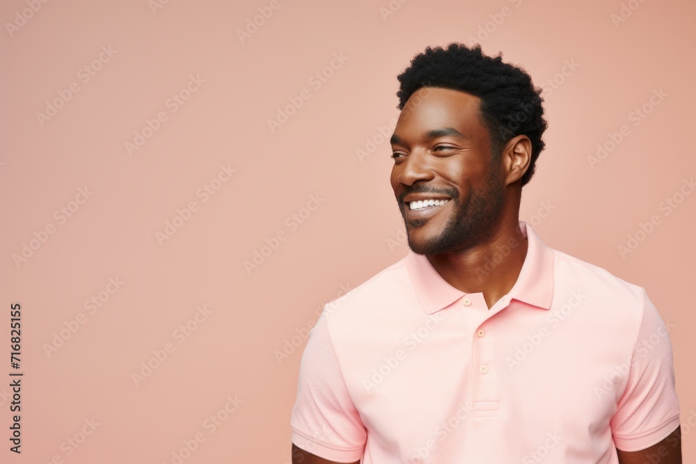 Portrait of a tender afro-american man in his 30s wearing a breathable golf polo against a pastel or soft colors background. AI Generation Portrait of a tender afro-american man in his 30s wearing a breathable golf polo against a pastel or soft colors background. AI Generation