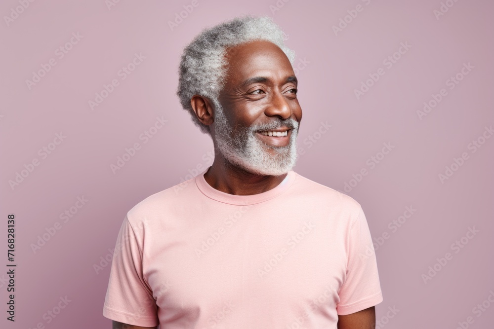 Portrait of a happy afro-american man in his 60s dressed in a casual t-shirt against a pastel or soft colors background. AI Generation Portrait of a happy afro-american man in his 60s dressed in a casual t-shirt against a pastel or soft colors background. AI Generation