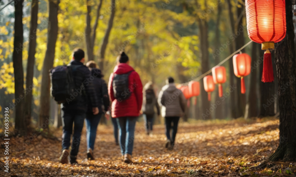 Obraz premium Chinese paper lanterns point people to the forest path.