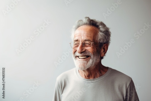 Portrait of a grinning man in his 80s donning a trendy cropped top against a minimalist or empty room background. AI Generation