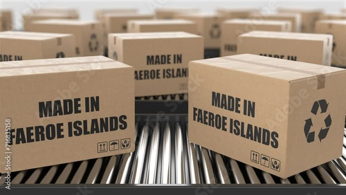 Cardboard boxes with Made in Faeroe Islands text on roller conveyor. Factory production line warehouse. Manufacture export or delivery concept. 3D render animation. Seamless loop photo