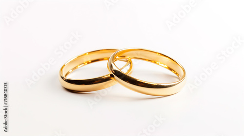 two_golden_rings_on_white_background