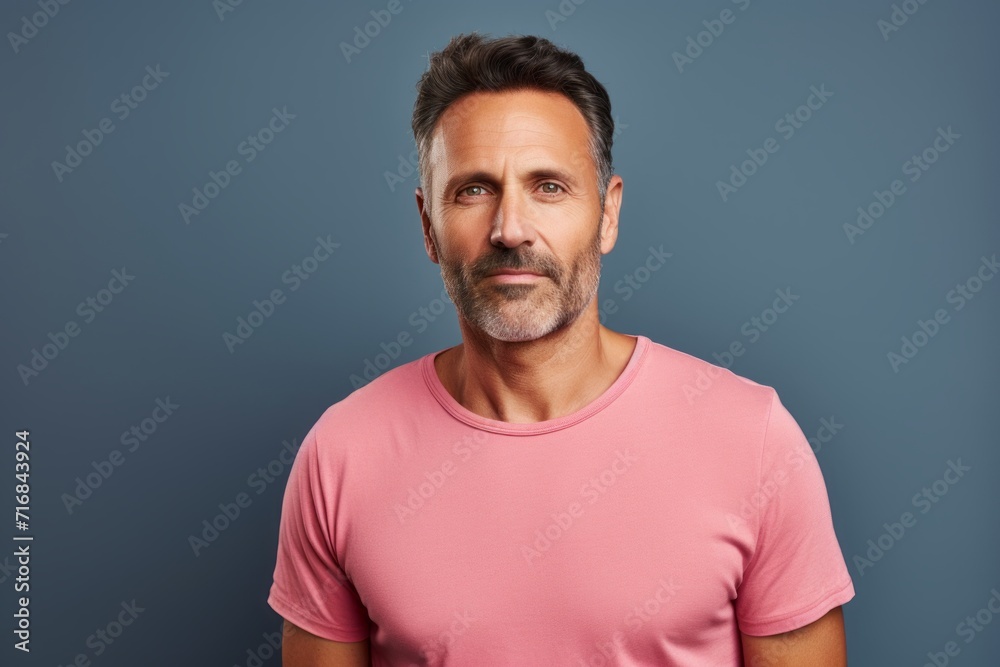 Portrait of a tender man in his 40s dressed in a casual t-shirt against a solid color backdrop. AI Generation Portrait of a tender man in his 40s dressed in a casual t-shirt against a solid color backdrop. AI Generation