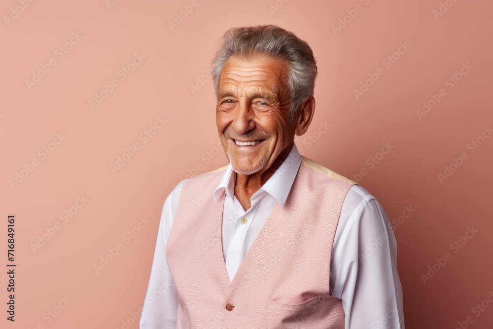Portrait of a grinning man in his 80s dressed in a breathable mesh vest against a solid pastel color wall. AI Generation Portrait of a grinning man in his 80s dressed in a breathable mesh vest against a solid pastel color wall. AI Generation