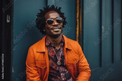 Portrait of a jovial afro-american man in his 40s wearing a trendy sunglasses against a scandinavian-style interior background. AI Generation