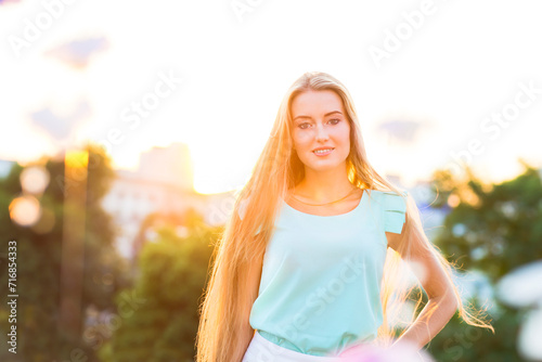 Outdoors portrait of beautiful young blond woman