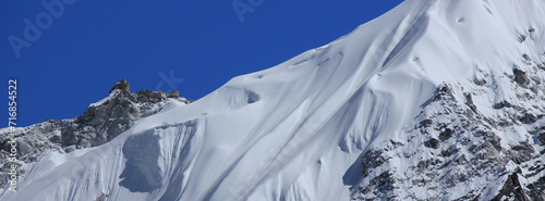 Detail of a snow covered glacier and peak  near Gorak Shep, Nepal. photo