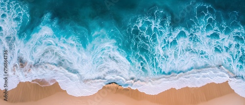 an aerial view of a beach with waves crashing on it and a blue ocean in the background, with a white sand beach and a blue sky