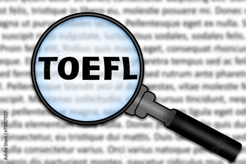 Focused on TOEFL exam. Word TOEFL under magnifying glass. International Test of English as a Foreign Language. Preparation to standardized test of English language. E-learning.  photo
