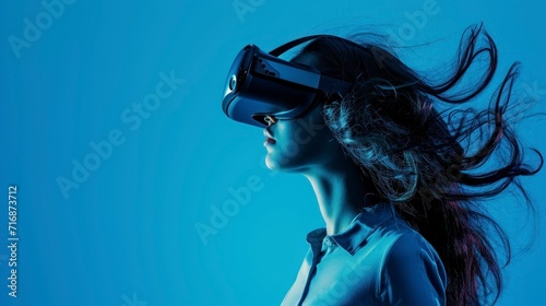 cute woman wearing virtual reality glasses on light blue background