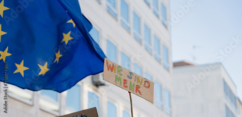 Flag of European Union and protest sign at demonstration against far-right political party AfD, hate and racicsm, anti-fascist demonstration in Nürnberg, Bayern, Germany photo