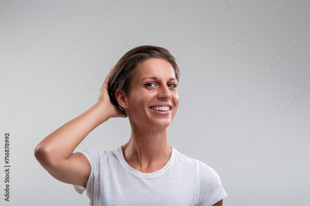 Fototapeta premium Happiness personified in relaxed pose, bright smile