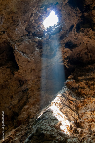 the Sun beam light through hole in the cave at thailand
