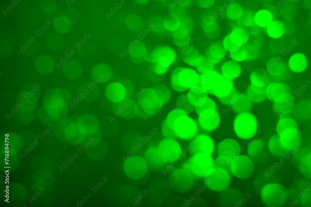 St. Patrick day. Green background with blurred lights, bokeh effect St. Patrick day. Green background with blurred lights, bokeh effect