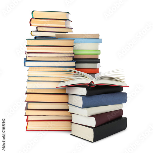 Stacks of different books isolated on white