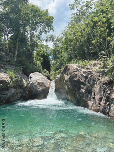 Waterfall between the mountain rocks. Quiet place in Pedreira waterfall - Lavrinhas- São Paulo, Brazil.