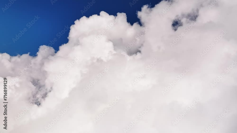 Flying through the clouds with a first-person view. Time lapse aerial view of weather changes high above the ground. weather background Flying through the clouds with a first-person view. Time lapse aerial view of weather changes high above the ground. weather background