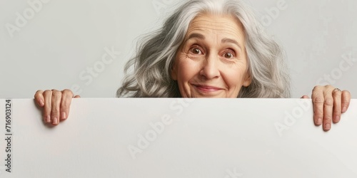 elderly woman holding a white banner in her hands Generative AI