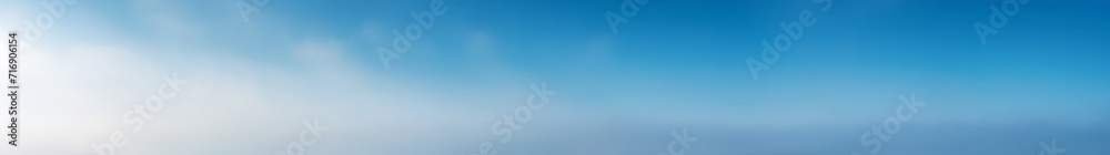 Vibrant extra wide panoramic sky. Fantasy banner sky. Rich colors. Blue sky. Soft fantasy clouds. Daytime sunny winter sky. Soft white clouds on a pure blue gradient sky. Vibrant extra wide panoramic sky. Fantasy banner sky. Rich colors. Blue sky. Soft fantasy clouds. Daytime sunny winter sky. Soft white clouds on a pure blue gradient sky.