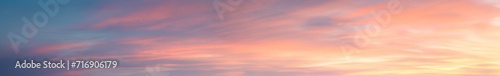 Pastel Vibrant extra wide panoramic sky. Fantasy banner sky. Rich colors. Daytime sunset beauty. Fiery glowing heavenly sky with gradient colors. Red, pink, orange, blue, yellow. © ana