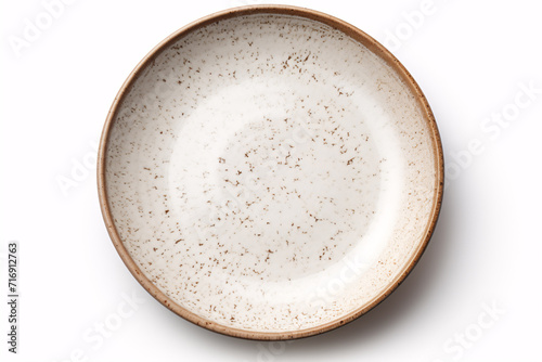 A ceramic disc, alone, on a pale background.