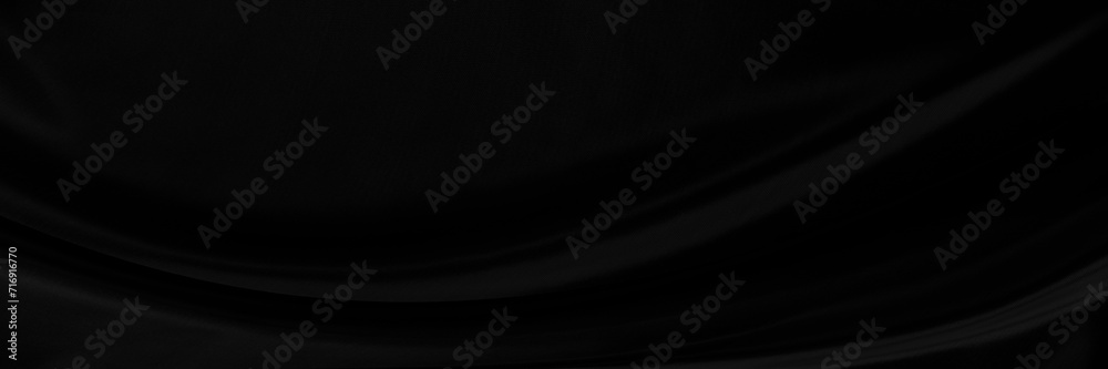 Black gray satin dark fabric texture luxurious shiny that is abstract silk cloth panorama background with patterns soft waves blur beautiful.