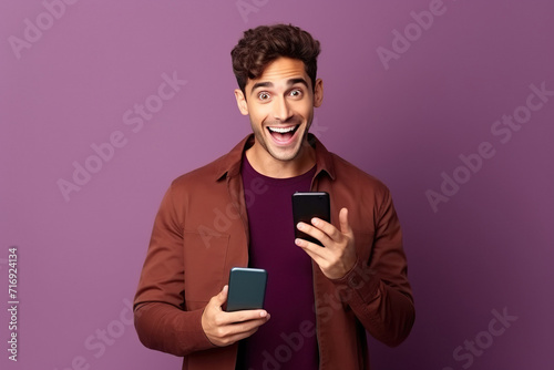 Young man hold cellphone amazed sales hold device wear trendy outfit isolated on color background © AI_images