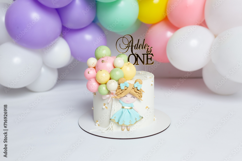 cake with beautiful children's decor on a background of balloons. birthday dessert cake with beautiful children's decor on a background of balloons. birthday dessert
