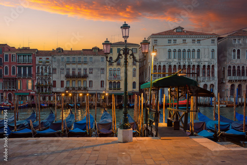 Sunrise on the Grand Canal with gondolas in Venice Italy
