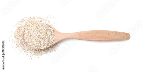 Spoon with raw barley groats isolated on white, top view photo