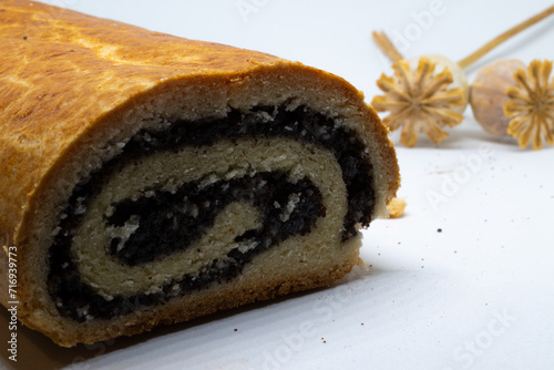Poppy seed roll and white background