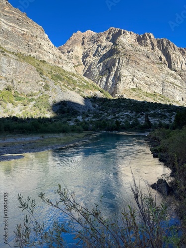 Deep blue mood of the Rio Cortaderal in Chile in the morning sun photo